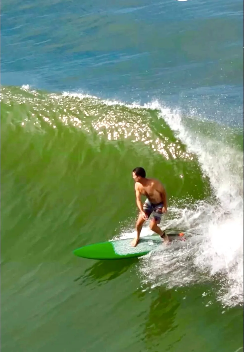 Surfing a breaking Pacific Ocean wave