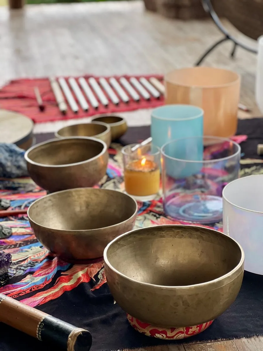 Sound healing instruments laid out for a session