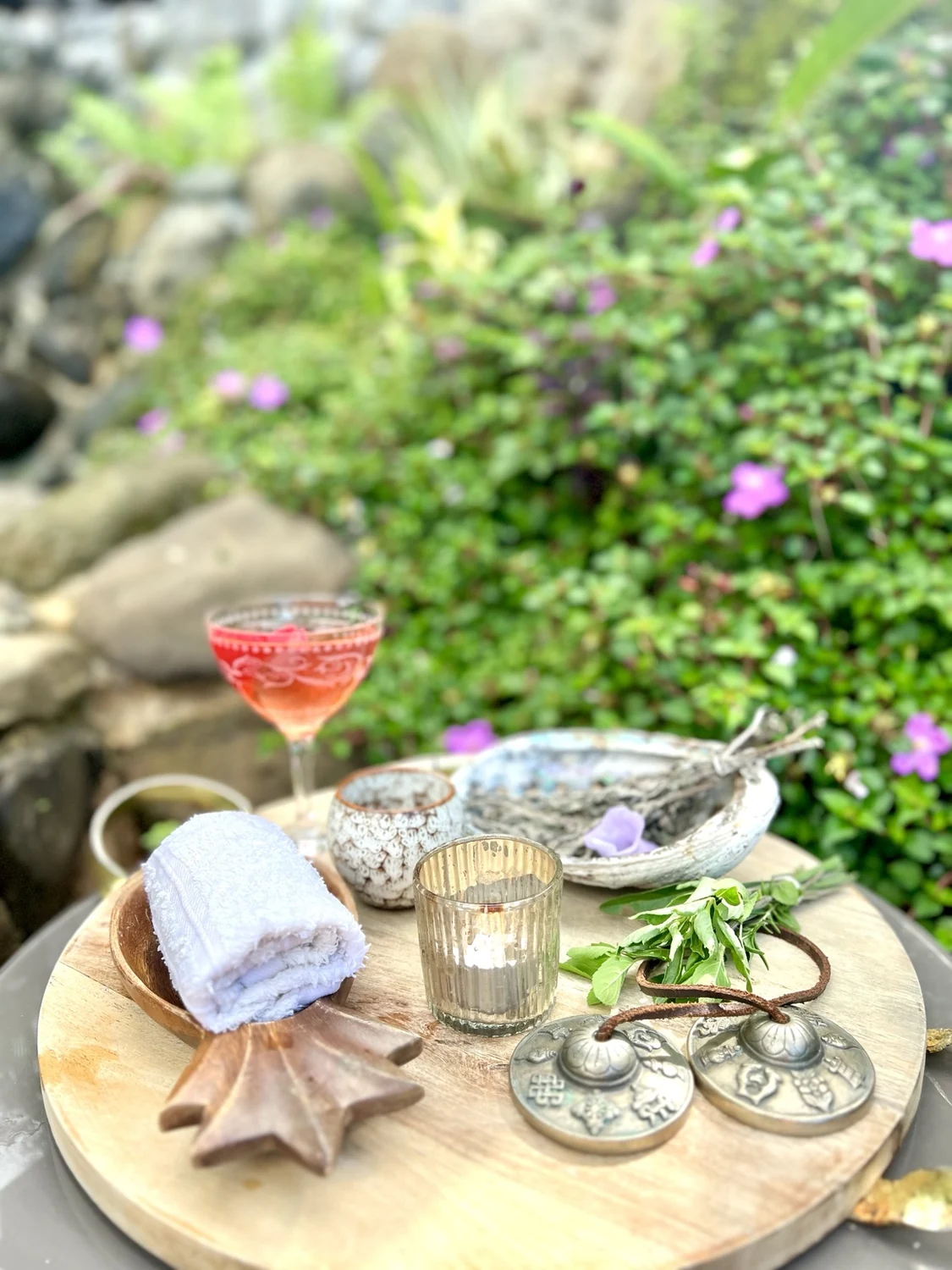 Thoughtful Green Door Spa tray with botanicals and warm towels