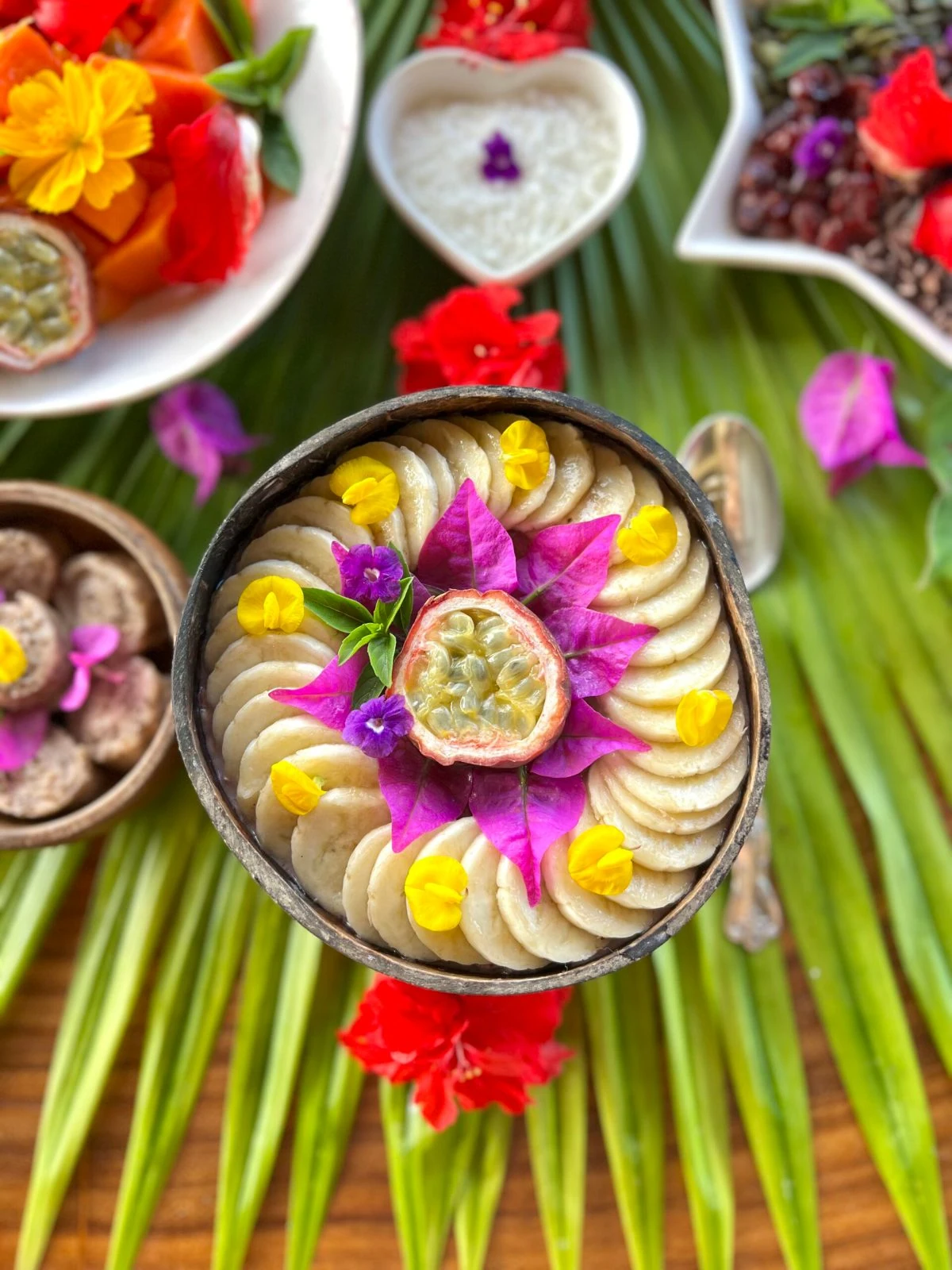 Colorful tropical fruit and flowers served for two