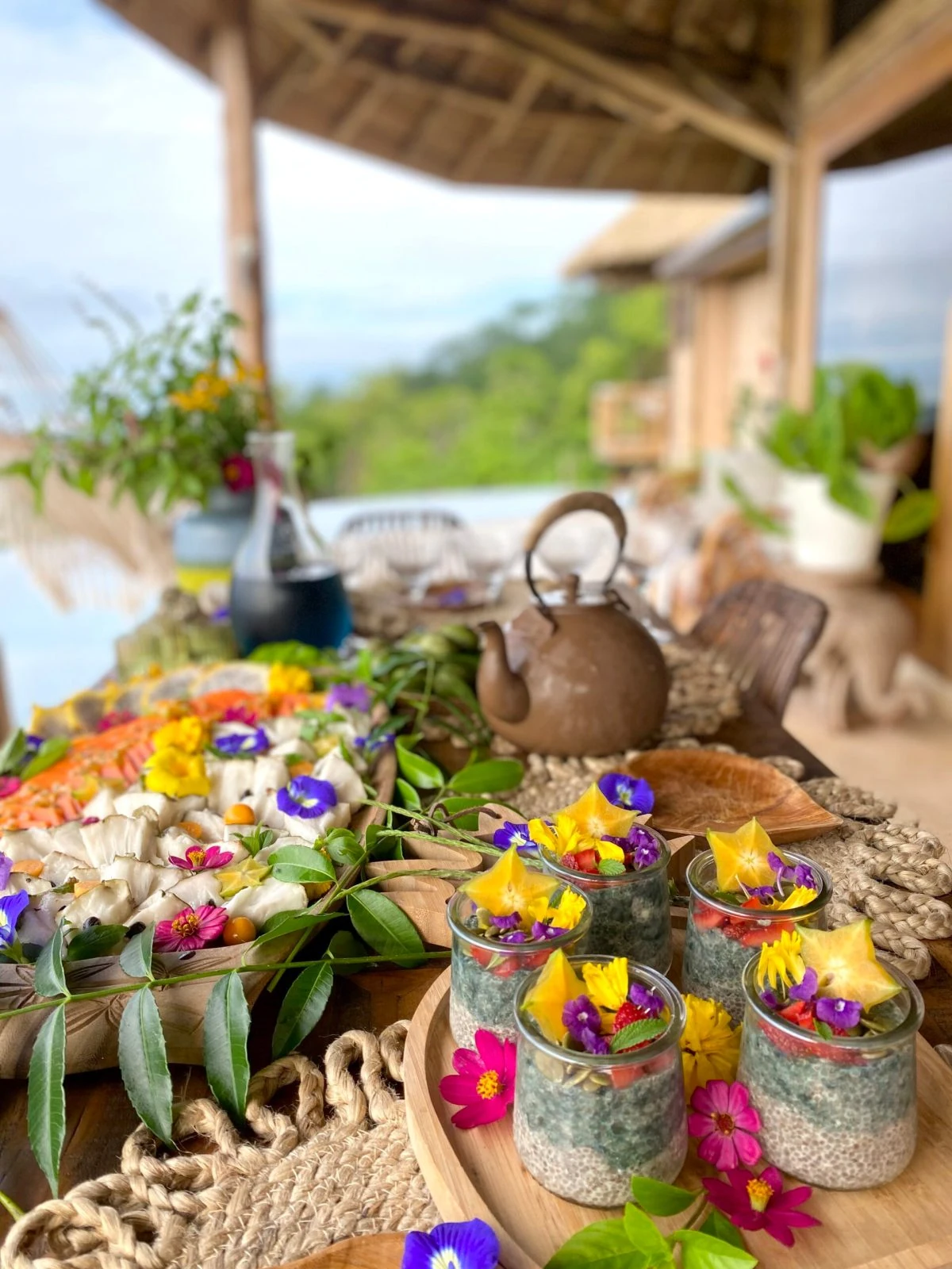 A beautiful living cuisine spread with tropical fruit and edible flowers