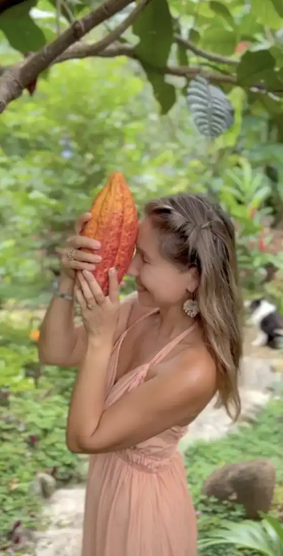 Lena Ropp with a freshly harvested cacao pod
