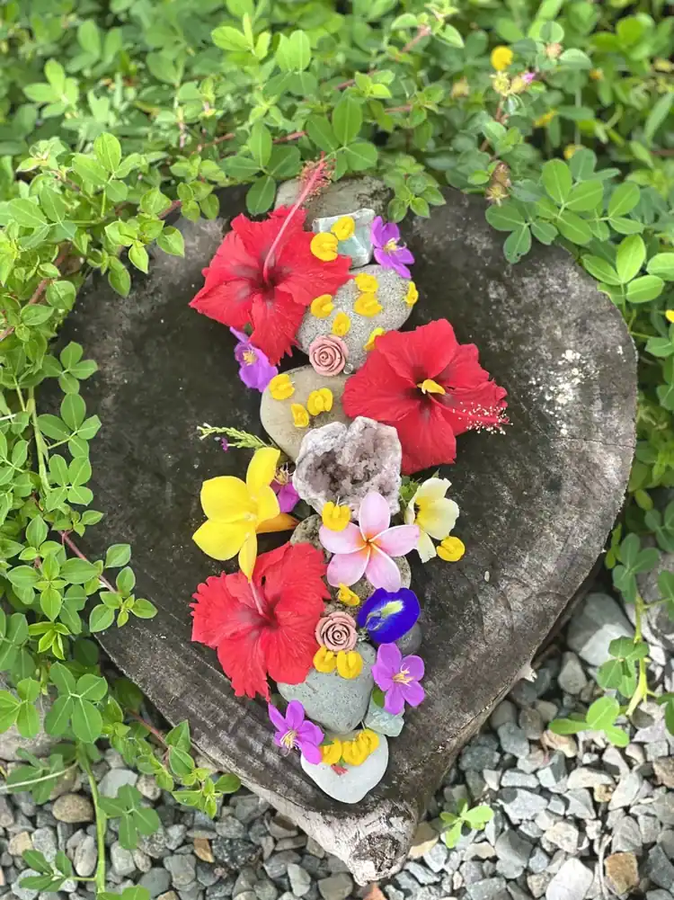 A floral arrangement of the gardens on natural stone