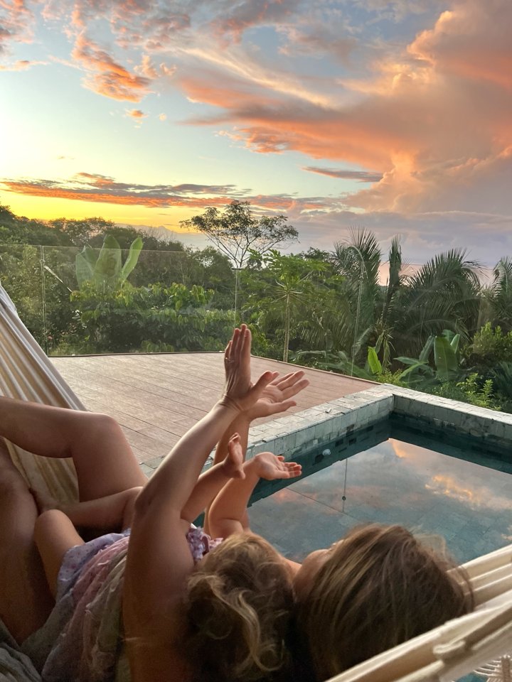 Enjoying the sunset from a hammock beside the pool