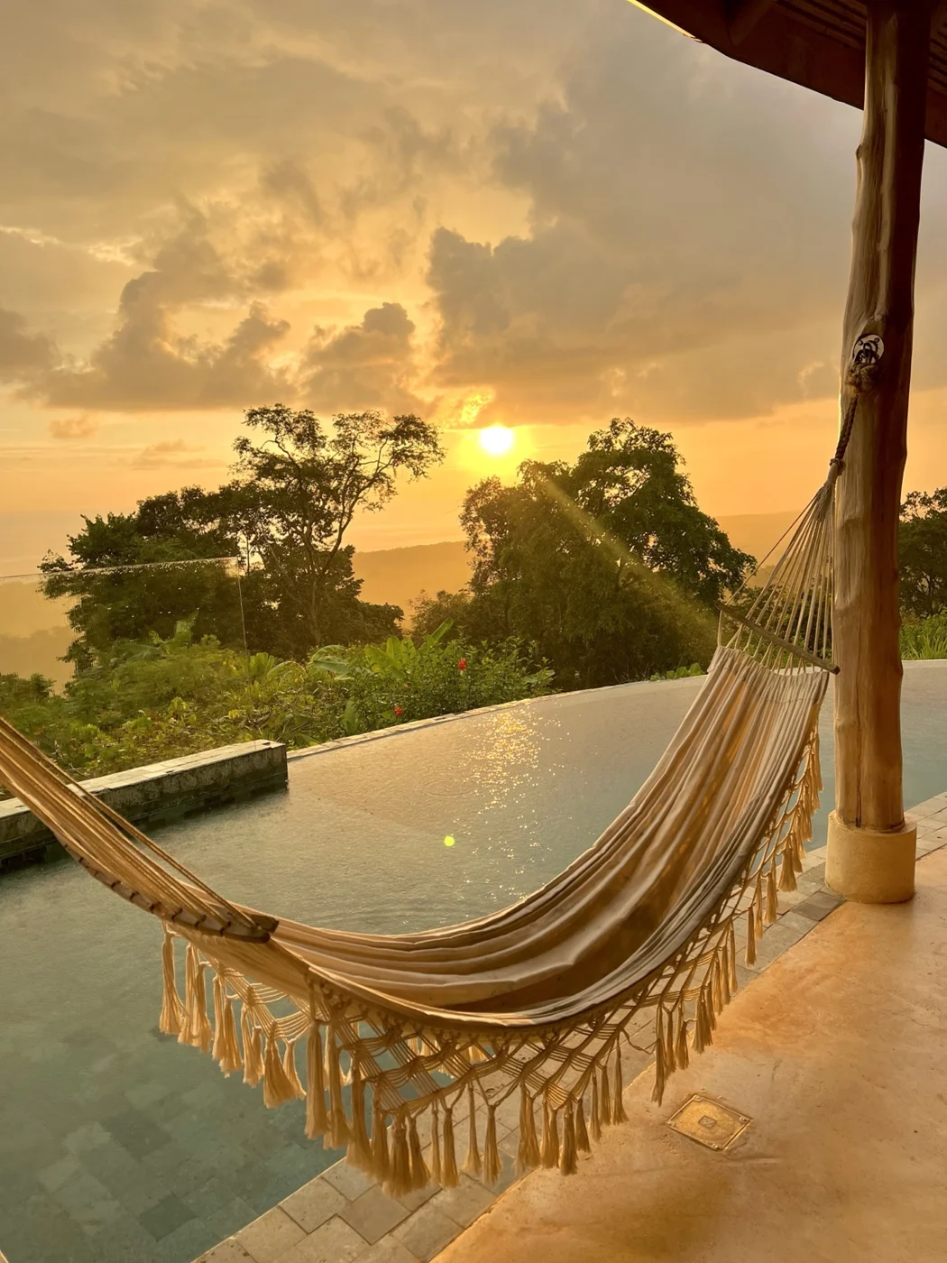 Hammock beside the infinity pool at sunset