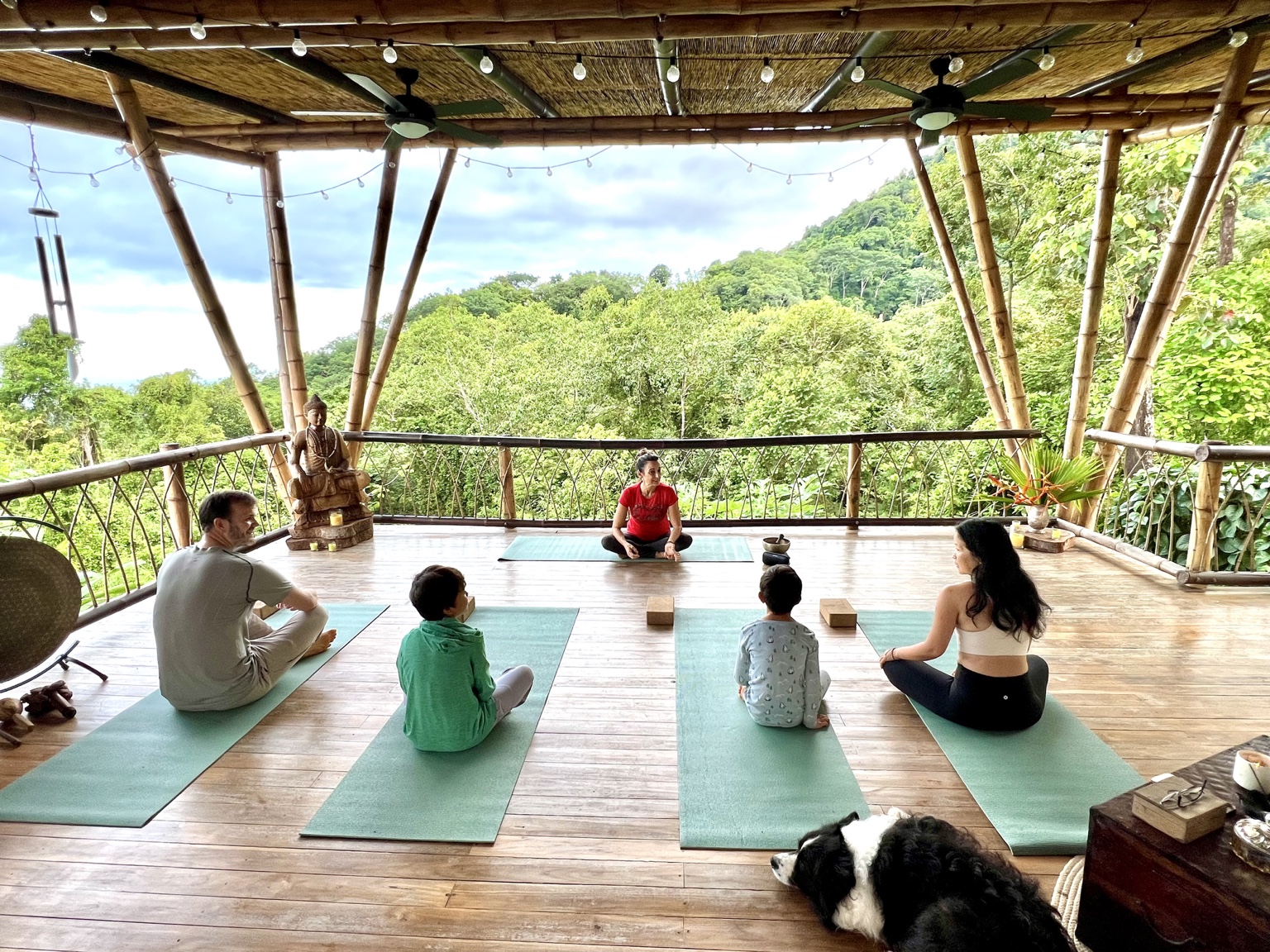 Family yoga in Wilder Sanctuary’s open-air rainforest shala